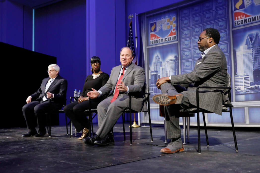 Mike Duggan, Mayor, City of Detroit, Gary Torgow, Chairman of Chemical Financial Corporation and Alicia George, Founder of Java House & Artist Village Detroit addresses the Detroit Economic Club meeting held at Cobo Center in Detroit, Michigan, on Tuesday